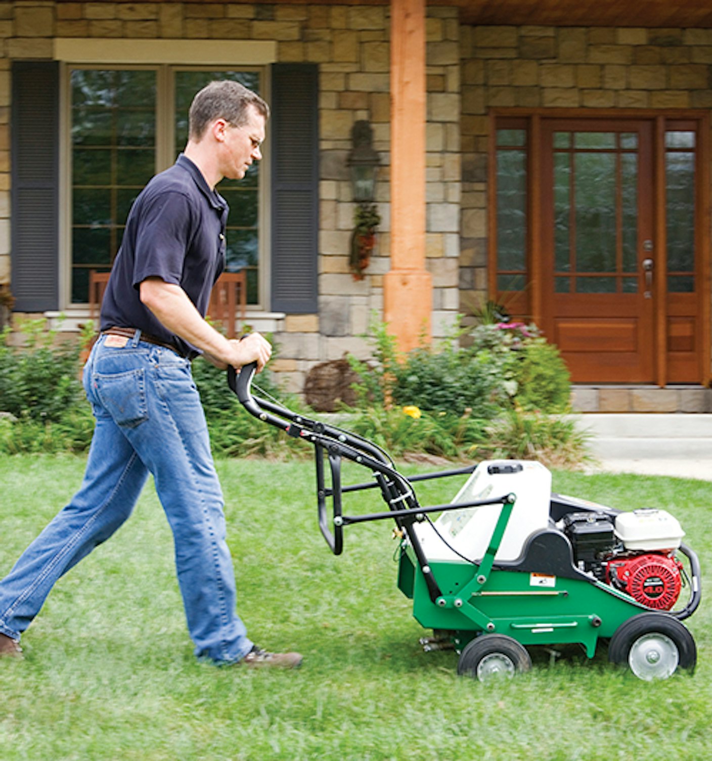 AE401 H man using areator infront of the house