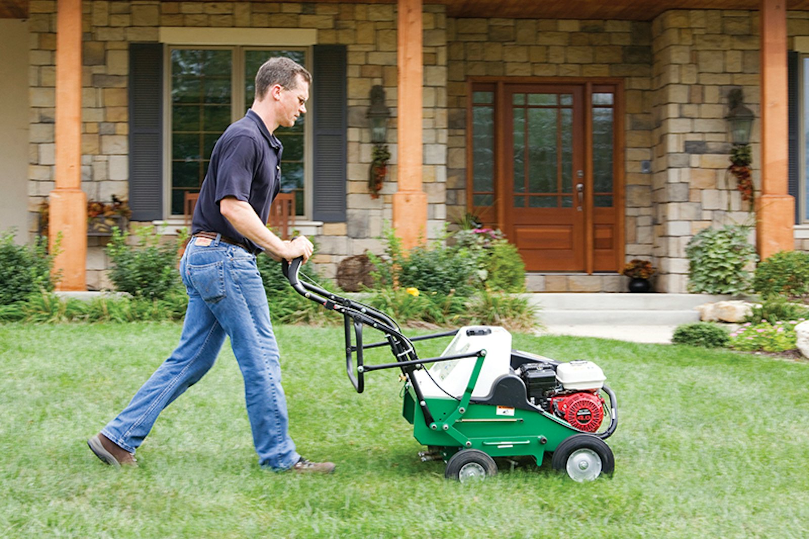 AE401 H man using areator infront of the house