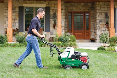 AE401 H man using areator infront of the house