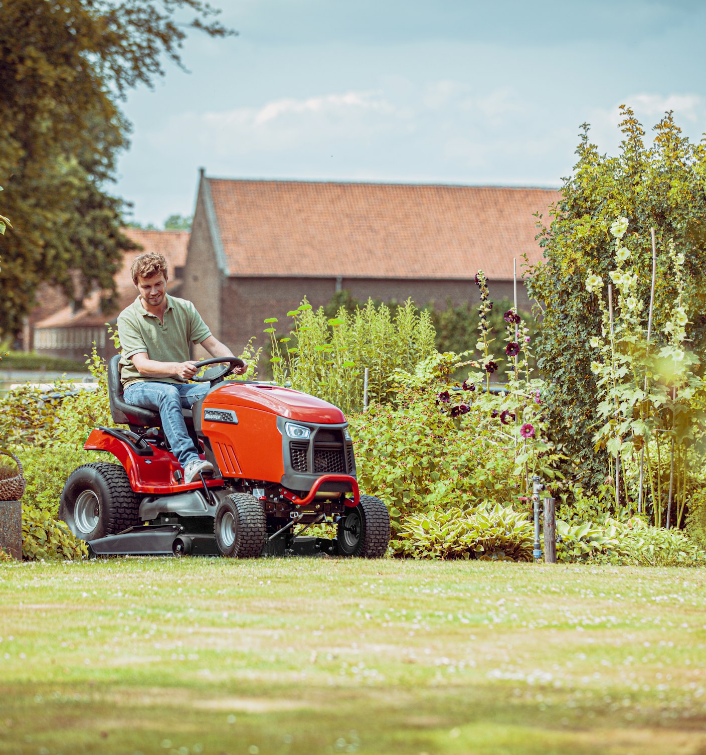 Man mowing lawn with SPX210