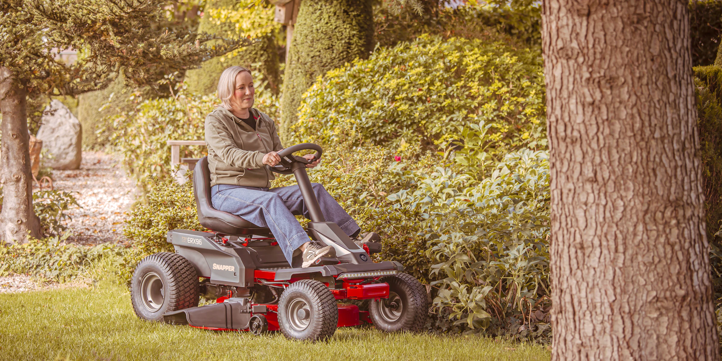 Lifestyle lady on erider erx96 behind tree