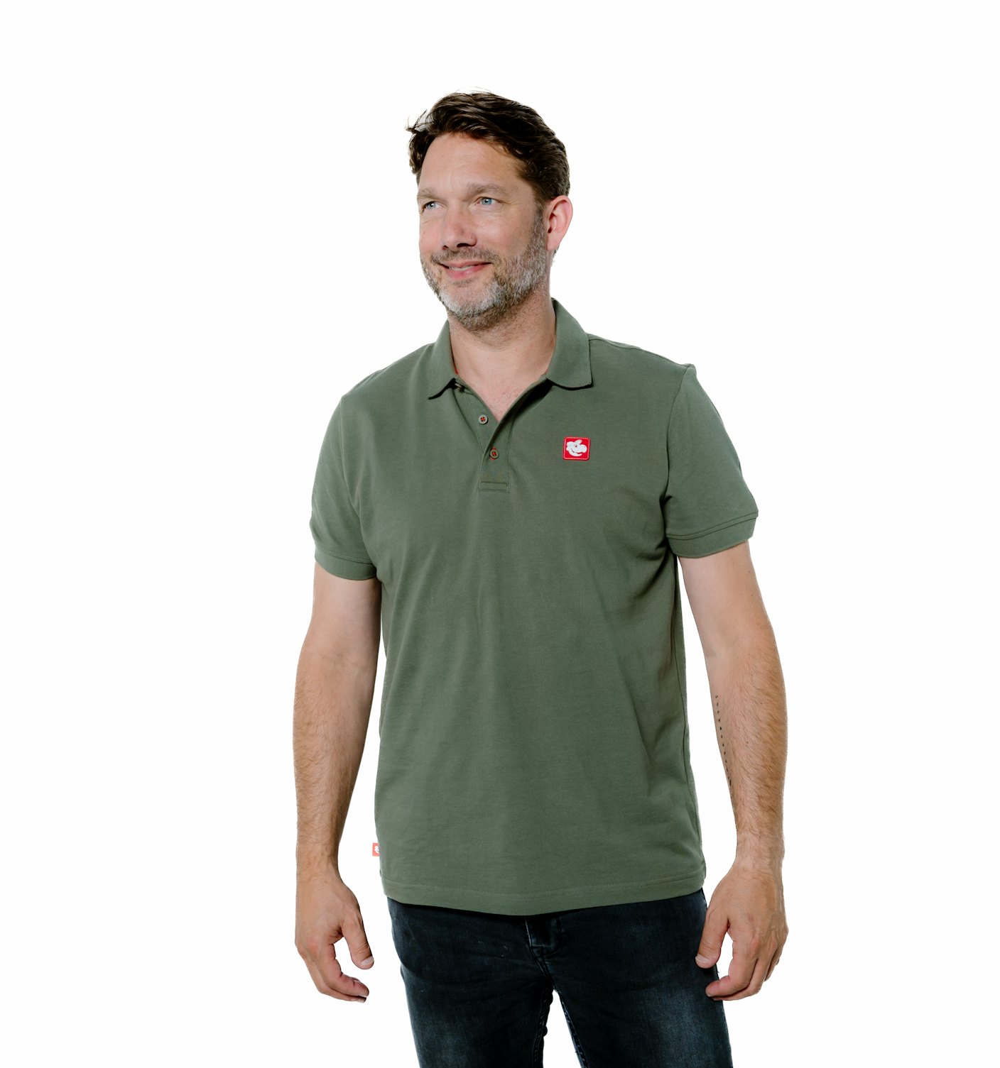 Dark haired man wears Snapper polo