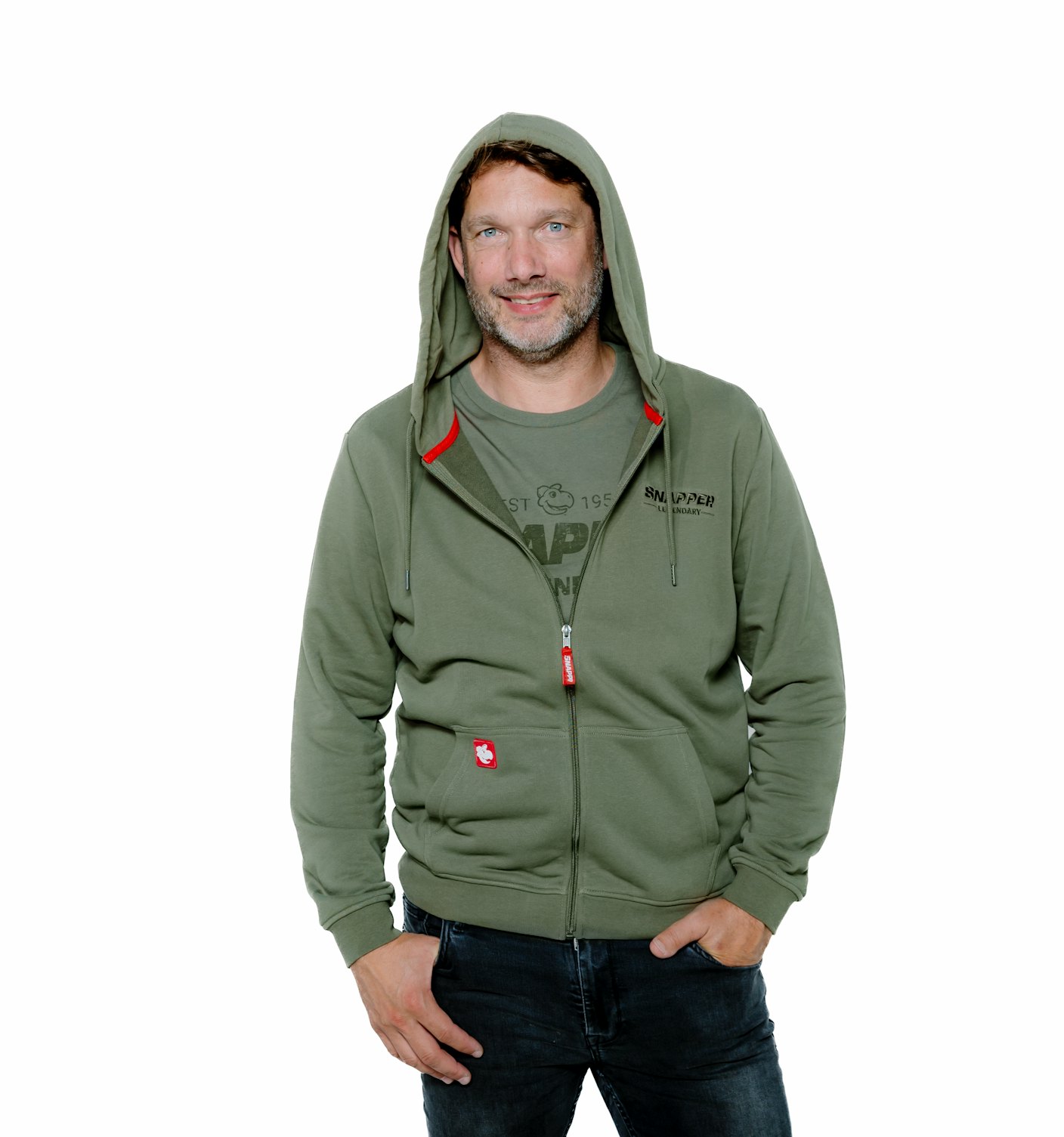 Front view dark haired man wears Snapper hoodie with hood up landscape